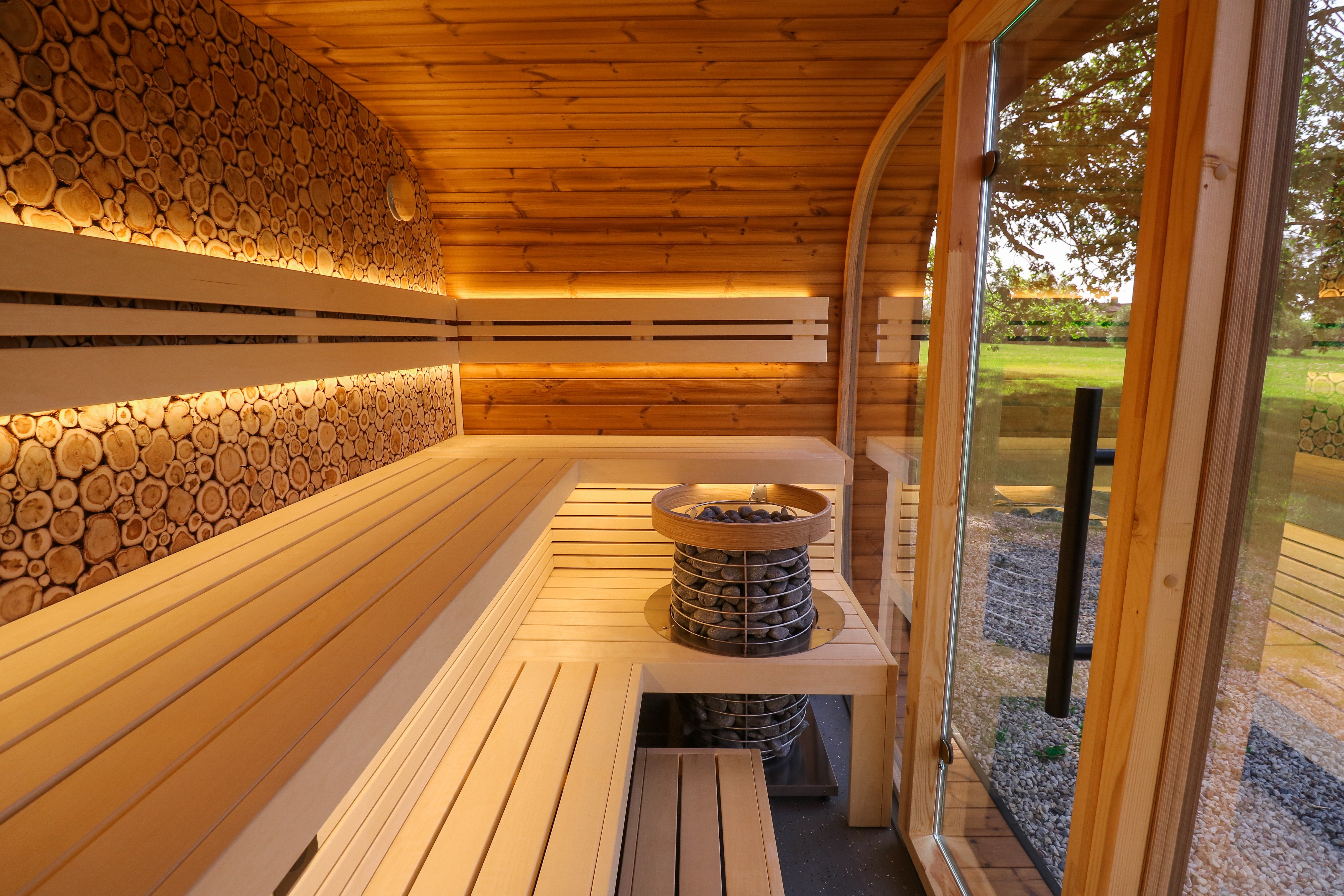 Soothing lighting in an outdoor sauna, backlit behind the backrests and under the bench.